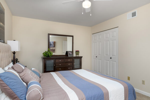 A bedroom and closets at Chesterfield Village Apartments