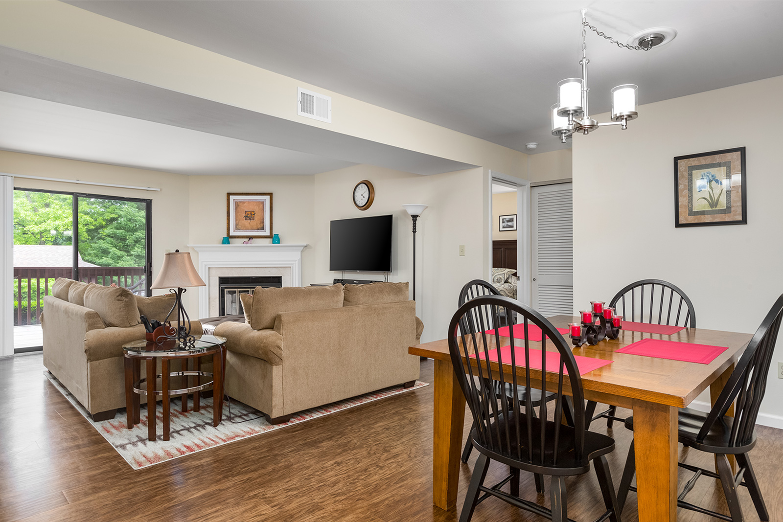 A dining room that leads into a living room at Chesterfield Village Apartments
