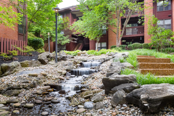 A babbling brook and apartments at Chesterfield Village Apartments
