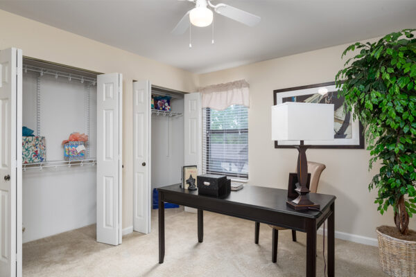 An office with open closets at Chesterfield Village Apartments