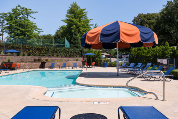 A view of the large umbrella near the pool at Chesterfield Village Apartments