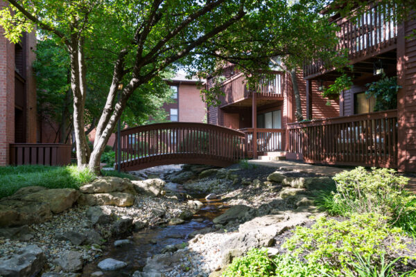 A bridge over a babbling brook at Chesterfield Village Apartments