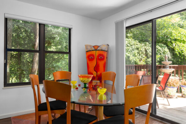 A dining room table with an outdoors view at Chesterfield Village Apartments